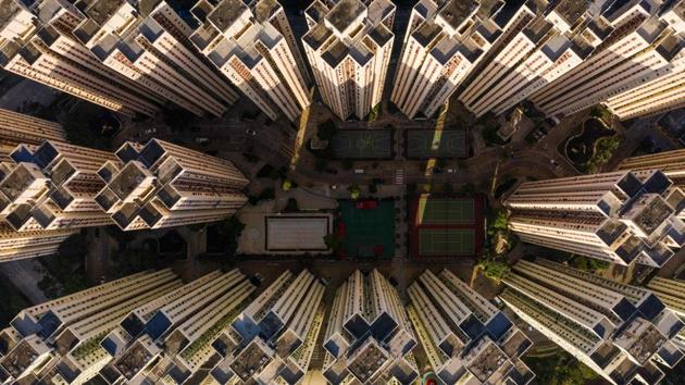 A highrise residential housing estate in Hong Kong. Visiting and cleaning the graves of ancestors is hugely important in Chinese culture with competition for the limited spots intense. Space in private columbariums can go for as much as HK$1 million ($130,000). (Dale de la Rey / AFP) A highrise residential housing estate in Hong Kong. Visiting and cleaning the graves of ancestors is hugely important in Chinese culture with competition for the limited spots intense. Space in private columbariums can go for as much as HK$1 million ($130,000). (Dale de la Rey / AFP)