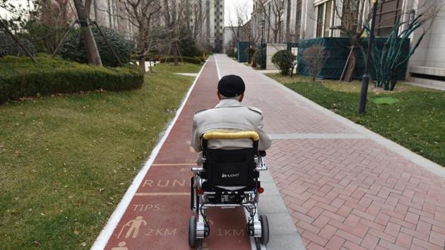 A resident makes his way back to his apartment in an electric wheelchair. “The idea that children should take care of their ageing parents is an old logic spanning thousands of years,” explained Li. “As society develops, this is changing.” (Greg Baker / AFP) A resident makes his way back to his apartment in an electric wheelchair. “The idea that children should take care of their ageing parents is an old logic spanning thousands of years,” explained Li. “As society develops, this is changing.” (Greg Baker / AFP)