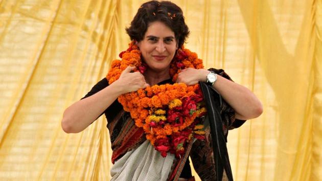 FILE PHOTO: Priyanka Gandhi Vadra adjusts her flower garlands as she campaigns for her mother Sonia Gandhi during an election meeting at Rae Bareli in Uttar Pradesh April 22, 2014. REUTERS/Pawan Kumar/File Photo(REUTERS)