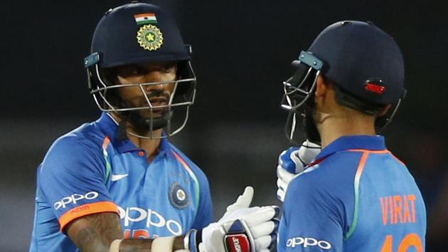 India's Virat Kohli, right, congratulates India's Shikhar Dhawan for scoring his half century. (AP)
