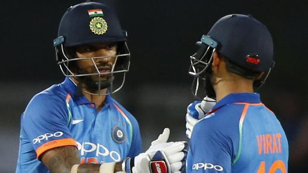 Virat Kohli, right, congratulates Shikhar Dhawan for scoring a half century. (AP) Virat Kohli, right, congratulates Shikhar Dhawan for scoring a half century. (AP)