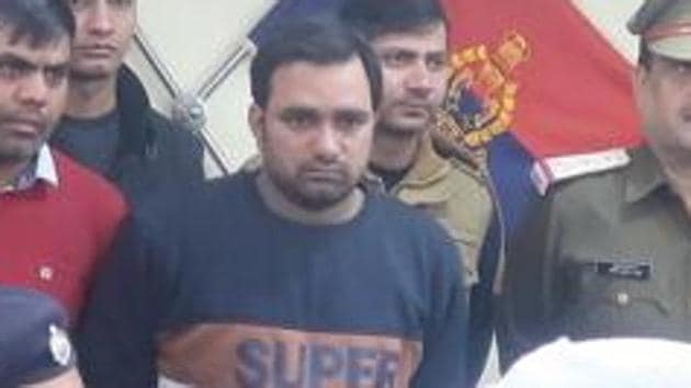 The accused (in blue T-shirt), a resident of Raipur village in Noida’s Sector 126, used to run a bakery in Sarfabad village. The accused (in blue T-shirt), a resident of Raipur village in Noida’s Sector 126, used to run a bakery in Sarfabad village.