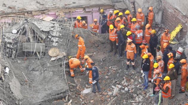 Rescuers from National Disaster Response Force (NDRF), State Disaster Response Force (SDRF) and Border Security Force (BSF) were trying to clear the debris with the help of bulldozers and look for survivors, officials said. (Yogendra Kumar/HT Photo) Rescuers from National Disaster Response Force (NDRF), State Disaster Response Force (SDRF) and Border Security Force (BSF) were trying to clear the debris with the help of bulldozers and look for survivors, officials said. (Yogendra Kumar/HT Photo)