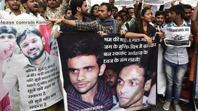 Kanhaiya Kumar, Umar Khalid and Anirban Bhattacharya (in posters) have been charged with sedition for allegedly shouting anti-India slogans at JNU in February 2016.(HT File)