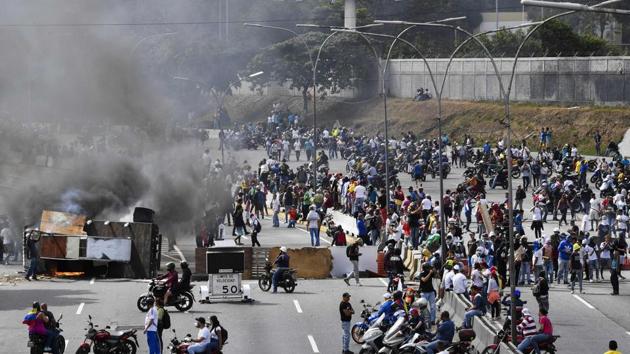 The deaths, mostly from gunshot wounds, were recorded in the capital and across the country, along with reports of looting in the Brazilian border state of Bolivar, the Venezuelan Observatory of Social Conflict told AFP. (AFP) The deaths, mostly from gunshot wounds, were recorded in the capital and across the country, along with reports of looting in the Brazilian border state of Bolivar, the Venezuelan Observatory of Social Conflict told AFP. (AFP)
