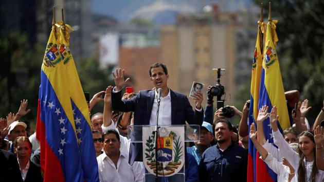 The head of the National Assembly, Juan Guaido, proclaimed himself “acting president” later on January 23 in front of cheering supporters gathered in Caracas. “I swear to formally assume the national executive powers as acting president of Venezuela to end the usurpation, (install) a transitional government and hold free elections,” Guaido declared. (Fernando Llano / AP) The head of the National Assembly, Juan Guaido, proclaimed himself “acting president” later on January 23 in front of cheering supporters gathered in Caracas. “I swear to formally assume the national executive powers as acting president of Venezuela to end the usurpation, (install) a transitional government and hold free elections,” Guaido declared. (Fernando Llano / AP)