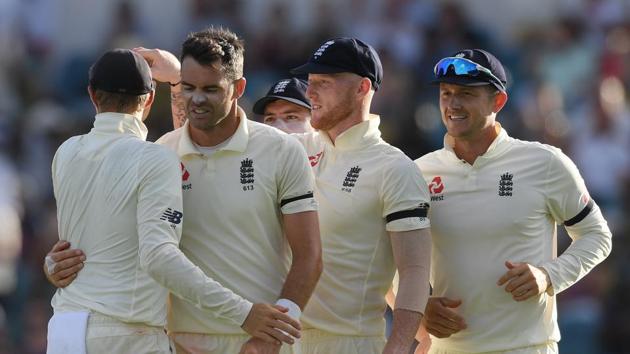 James Anderson of England is congratulated by team-mates after taking the wicket of Roston Chase. (AFP) James Anderson of England is congratulated by team-mates after taking the wicket of Roston Chase. (AFP)
