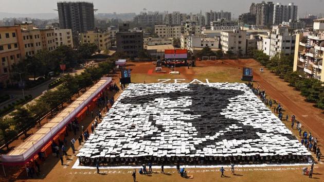 Students of Zeal institute create a formation of India's freedom fighter, Bhagat Singh on the eve of 70th Republic Day of India in the college premise on Friday. The formation was created by 3,536 students and was a successful attempt to create a record in Golden Book of World Records. (Pratham Gokhale/HT Photo) 