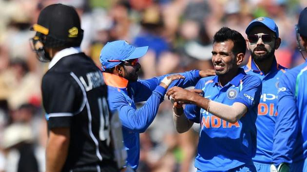 File image of Indian cricketers celebrating the fall of a wicket during the first ODI against New Zealand.(AFP)