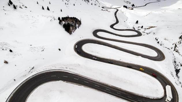 Steep turns on the winding road leading up to the Julierpass that connects the Engadin valley to the rest of the canton of Graubuenden are pictured in Bivio, Switzerland. (Valentin Flauraud / Keystone via AP) Steep turns on the winding road leading up to the Julierpass that connects the Engadin valley to the rest of the canton of Graubuenden are pictured in Bivio, Switzerland. (Valentin Flauraud / Keystone via AP)