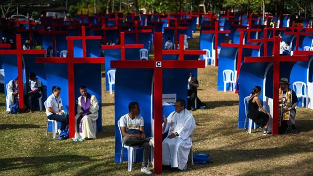 Pilgrims confess at the Youth Park in Panama City on the eve of the arrival of Pope Francis for World Youth Day. (Luis Acosta / AFP) Pilgrims confess at the Youth Park in Panama City on the eve of the arrival of Pope Francis for World Youth Day. (Luis Acosta / AFP)
