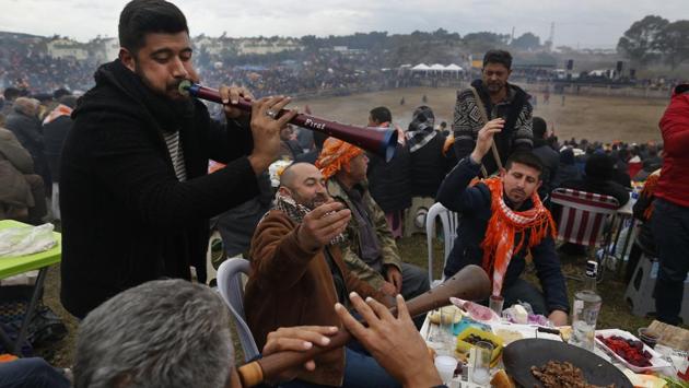 Musicians perform traditional folk songs, as spectators enjoy on the hill overlooking the arena. Braveheart, Crazy Hasan, The Conqueror and Black Diamond were among the furry, hump-backed contestants in this year’s annual sporting showdown. (Lefteris Pitarakis / AP) Musicians perform traditional folk songs, as spectators enjoy on the hill overlooking the arena. Braveheart, Crazy Hasan, The Conqueror and Black Diamond were among the furry, hump-backed contestants in this year’s annual sporting showdown. (Lefteris Pitarakis / AP)