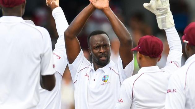 Kemar Roach (C) of West Indies celebrates the dismissal of Ben Stokes of England during day 2 of the 1st Test between West Indies and England. (AFP) Kemar Roach (C) of West Indies celebrates the dismissal of Ben Stokes of England during day 2 of the 1st Test between West Indies and England. (AFP)