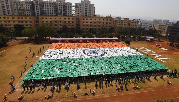 Students of Zeal institute create formation of India's national flag on the eve of Republic Day of India in the college premise.(Pratham Gokhale/HT File Photo)