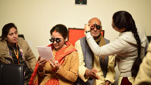 Visiting pilgrims have their eyes tested at a camp during the Kumbh Mela, at Netra Kumbh, Sangam, in Prayagraj, Uttar Pradesh. (Sheeraz Rizvi / HT Photo) Visiting pilgrims have their eyes tested at a camp during the Kumbh Mela, at Netra Kumbh, Sangam, in Prayagraj, Uttar Pradesh. (Sheeraz Rizvi / HT Photo)