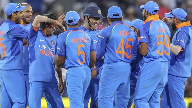 India congratulate MS Dhoni, center in helmet, after he stumped New Zealand's Ross Taylor. (AP) India congratulate MS Dhoni, center in helmet, after he stumped New Zealand's Ross Taylor. (AP)