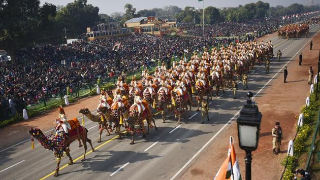 The Border Security Force contingent on decked out camels marches through Rajpath, its troops in matching moustaches and all taller than 6 feet. (Raj K Raj / HT Photo) The Border Security Force contingent on decked out camels marches through Rajpath, its troops in matching moustaches and all taller than 6 feet. (Raj K Raj / HT Photo)