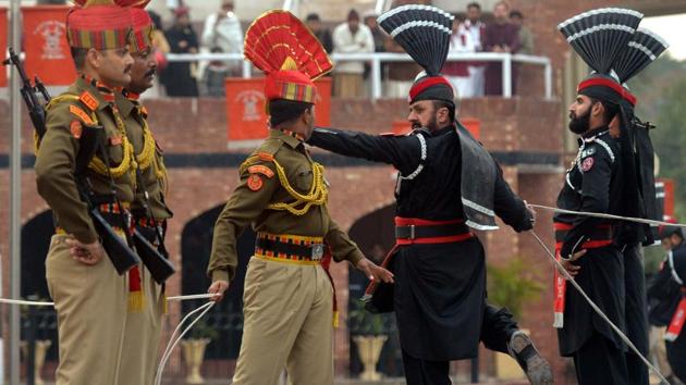 Border Security Force personnel in brown uniforms and Pakistani Rangers in black uniforms perform during the Beating Retreat ceremony at the India-Pakistan Wagah-Attari border post, about 35 kms from Amritsar, Punjab. (Narinder Nanu / AFP) Border Security Force personnel in brown uniforms and Pakistani Rangers in black uniforms perform during the Beating Retreat ceremony at the India-Pakistan Wagah-Attari border post, about 35 kms from Amritsar, Punjab. (Narinder Nanu / AFP)