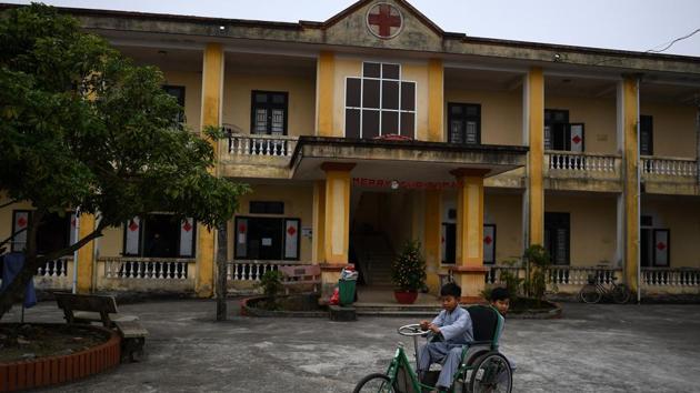 A young Vietnamese boy rides a tricycle for a leprosy patient at the Van Mon Leprosy hospice. “There were about 2,000 people here then, mostly young people. It was fun because we started a teen union,” the 80-year-old told AFP, sitting on his bed with his wife Teo of 54 years. (Manan Vatsyayana / AFP) A young Vietnamese boy rides a tricycle for a leprosy patient at the Van Mon Leprosy hospice. “There were about 2,000 people here then, mostly young people. It was fun because we started a teen union,” the 80-year-old told AFP, sitting on his bed with his wife Teo of 54 years. (Manan Vatsyayana / AFP)
