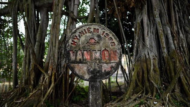 An old concrete sign bears the name of the Van Mon Leprosy hospice. His daughter no longer visits and his grandchildren come only once a year, so he has little to look forward to most days, he says. But many like Bac chose to stay, fearing they will be a burden on their families, or lose the care and small stipend provided at the government-run hospital. (Manan Vatsyayana / AFP) An old concrete sign bears the name of the Van Mon Leprosy hospice. His daughter no longer visits and his grandchildren come only once a year, so he has little to look forward to most days, he says. But many like Bac chose to stay, fearing they will be a burden on their families, or lose the care and small stipend provided at the government-run hospital. (Manan Vatsyayana / AFP)