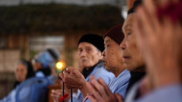 Leprosy survivors offering prayers on the 15th day of lunar month at a pagoda in the hospice. “I have no one to count on, I’m so lonely, so I just follow God. When I die I will follow God then too,” said Pham Van Bac, 83, who has been at the centre since 1960. (Manan Vatsyayana / AFP) Leprosy survivors offering prayers on the 15th day of lunar month at a pagoda in the hospice. “I have no one to count on, I’m so lonely, so I just follow God. When I die I will follow God then too,” said Pham Van Bac, 83, who has been at the centre since 1960. (Manan Vatsyayana / AFP)