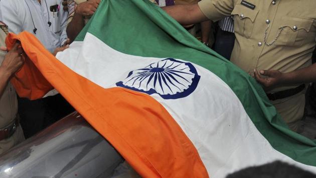 India is likely to lodge a protest on Monday against lack of security measures to prevent the burning of its national flag outside the Indian high commission on Republic Day.(AP) India is likely to lodge a protest on Monday against lack of security measures to prevent the burning of its national flag outside the Indian high commission on Republic Day.(AP)
