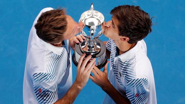 France's Pierre-Hugues Herbert and Nicolas Mahut celebrate with the trophy after winning the final against Finland's Henri Kontinen and Australia's John Peers.(REUTERS)
