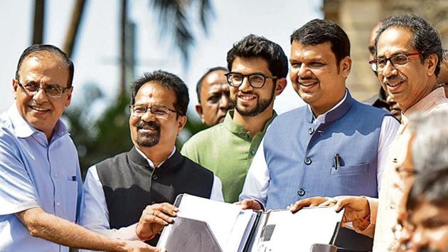 Maharashtra CM Devendra Fadnavis (second from right) with Shiv Sena chief Uddhav Thackery (right) and his son Aditya Thackeray (in green). (Kunal Patil/HT File) Maharashtra CM Devendra Fadnavis (second from right) with Shiv Sena chief Uddhav Thackery (right) and his son Aditya Thackeray (in green). (Kunal Patil/HT File)