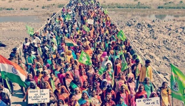 Thousands of tribals took out a 30-km long foot rally from Kevadiya to Rajpipla in Gujarat’s Narmada district to protest against infrastructure development around the Statue of Unity.(HT Photo)