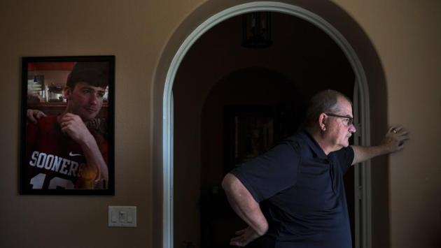 For months, Doug sat silently. He pretended when he could that it wasn’t real. He nailed two coat hooks to the wall in his home office and hung Landon’s jackets there, as though his son had just stopped by. He would have wished for death if he didn’t have Mollie and Brittaney, so instead he started talking to the box of his son’s ashes. He said he was sorry he couldn’t save him. (Jae C. Hong / AP) For months, Doug sat silently. He pretended when he could that it wasn’t real. He nailed two coat hooks to the wall in his home office and hung Landon’s jackets there, as though his son had just stopped by. He would have wished for death if he didn’t have Mollie and Brittaney, so instead he started talking to the box of his son’s ashes. He said he was sorry he couldn’t save him. (Jae C. Hong / AP)
