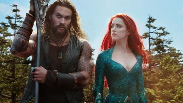 This image released by Warner Bros. Pictures shows Jason Momoa, left, and Amber Heard in a scene from the film, Aquaman.(AP)