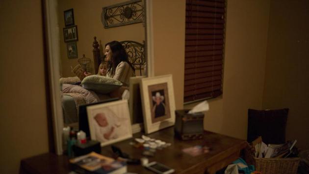 Landon Biggers’ longtime girlfriend, Megan Dealbert, reads a bedtime story to their daughter, Aubrey, in the room where Landon died. Dealbert, now a single mother, is raising their baby daughter alone. Her half-sister also died of an overdose a year before Landon. Her father, Daniel, buried her in the cemetery plot that had been meant for him. (Jae C. Hong / AP) Landon Biggers’ longtime girlfriend, Megan Dealbert, reads a bedtime story to their daughter, Aubrey, in the room where Landon died. Dealbert, now a single mother, is raising their baby daughter alone. Her half-sister also died of an overdose a year before Landon. Her father, Daniel, buried her in the cemetery plot that had been meant for him. (Jae C. Hong / AP)