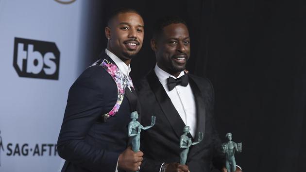 Michael B Jordan, left, and Sterling K. Brown, winners of the award for outstanding performance by a cast in a motion picture for Black Panther pose in the press room at the 25th annual Screen Actors Guild Awards at the Shrine Auditorium.(Jordan Strauss/Invision/AP)