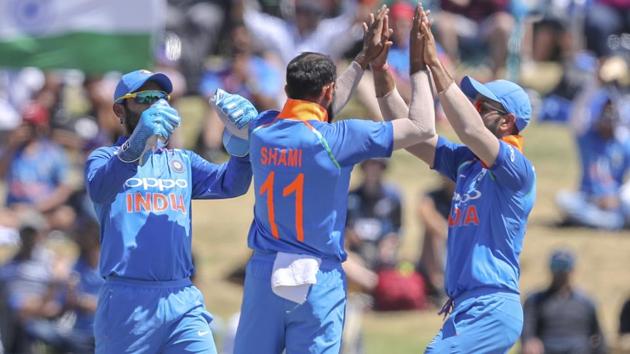 India's Mohammad Shami, second right, is congratulated by Virat Kohli. (AP) India's Mohammad Shami, second right, is congratulated by Virat Kohli. (AP)