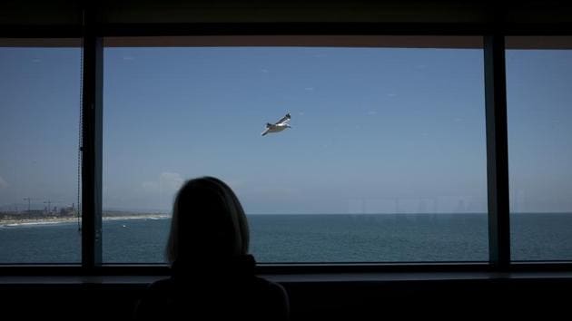 A bird flies in the distance behind Mollie Biggers as she waits in a restaurant to meet the girlfriend of her deceased son. Mollie and her husband try to see Aubrey as often as they can because she helps them feel connected to their lost son. (Jae C. Hong / AP) A bird flies in the distance behind Mollie Biggers as she waits in a restaurant to meet the girlfriend of her deceased son. Mollie and her husband try to see Aubrey as often as they can because she helps them feel connected to their lost son. (Jae C. Hong / AP)