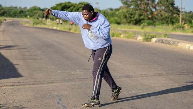 The nearby townships of Emakhandeni and Cowdray Park have scant health facilities, and the bridge is a safe, social spot for anyone looking to burn some calories at the start of the day. On Sunday, two young footballers did warm-up drills under the eye of their coach, groups of men worked out together and a couple shared a laugh as they exercised while children joined in. (Zinyange Auntony / AFP) The nearby townships of Emakhandeni and Cowdray Park have scant health facilities, and the bridge is a safe, social spot for anyone looking to burn some calories at the start of the day. On Sunday, two young footballers did warm-up drills under the eye of their coach, groups of men worked out together and a couple shared a laugh as they exercised while children joined in. (Zinyange Auntony / AFP)