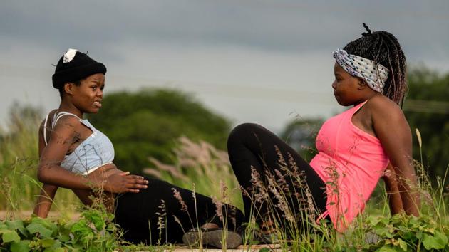 “I come with my sisters as early as we can, like at 5 am, and we come every day,” said Sidumsile Mthethwa, a 20-year-old arts student. “On Sundays we come before church. “It keeps kids busy, and it allows us to spend time together -- others come from different places around so we meet here. We connect as young people and we get to know each other better.” (Zinyange Auntony / AFP) “I come with my sisters as early as we can, like at 5 am, and we come every day,” said Sidumsile Mthethwa, a 20-year-old arts student. “On Sundays we come before church. “It keeps kids busy, and it allows us to spend time together -- others come from different places around so we meet here. We connect as young people and we get to know each other better.” (Zinyange Auntony / AFP)