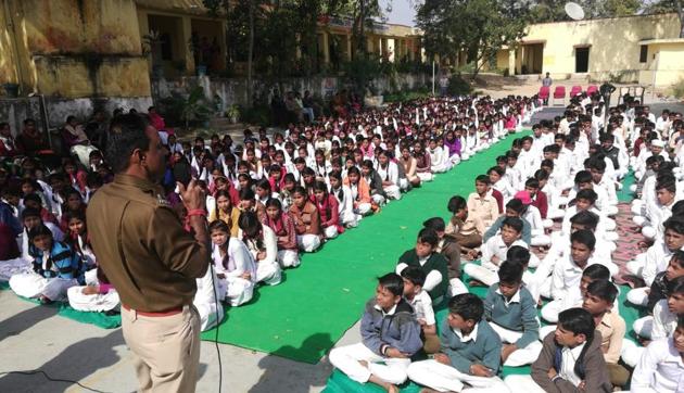 A police officer in Dungarpur district addresses school students. A police officer in Dungarpur district addresses school students.