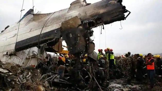 Rescue workers near the wreckage of the US-Bangla Airlines plane that crashed at the Tribhuvan International Airport in Kathmandu, Nepal March 12, 2018.(Reuters Photo)