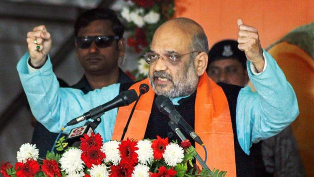 Bharatiya Janata Party (BJP) National President Amit Shah addresses a 30,000 booth-level party workers conference at Kulia, in Niutao district. Amit Shah slammed West Bengal Chief Minister Mamata Banerjee on refusal to fund Ayushman Bharat scheme. “She stopped funding it since she was afraid that it will encourage people to vote for Modi,” Shah said. (PTI) Bharatiya Janata Party (BJP) National President Amit Shah addresses a 30,000 booth-level party workers conference at Kulia, in Niutao district. Amit Shah slammed West Bengal Chief Minister Mamata Banerjee on refusal to fund Ayushman Bharat scheme. “She stopped funding it since she was afraid that it will encourage people to vote for Modi,” Shah said. (PTI)