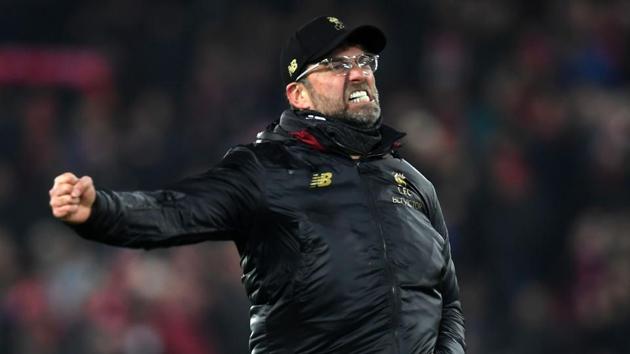 Liverpool's German manager Jurgen Klopp celebrates their victory on the pitch after the English Premier League football match between Liverpool and Crystal Palace at Anfield in Liverpool(AFP)
