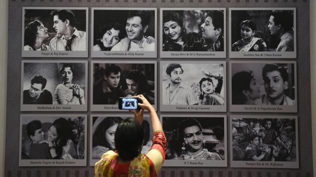 A visitor takes a picture of a display with images of former Indian movie actors at the National Museum of Indian Cinema (NMIC), the country’s first museum showcasing the history of its film industry, in Mumbai. “It showcases to the world outside what Indian cinema has achieved in its entirety over more than 100 years,” Amrit Gangar, a consulting curator on the project, told AFP. (Punit Paranjpe / AFP)