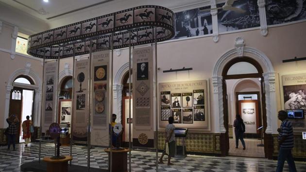 Visitors browse through exhibits. They are also able to view hand-painted movie posters, including for internationally acclaimed director Satyajit Ray’s 1955 hit “Pather Panchali”, and click selfies beside a statue of Bollywood icon Raj Kapoor. (Punit Paranjpe / AFP)