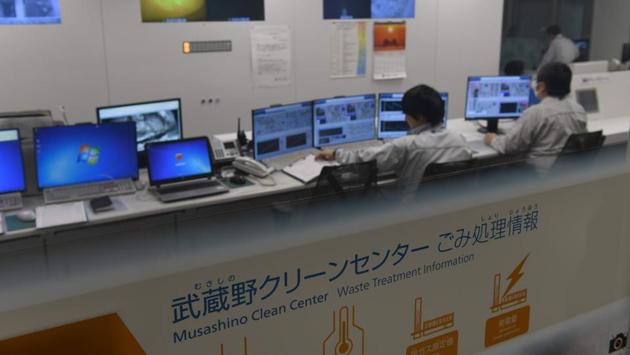 The central control room of the waste pit at the Musashino Clean Centre in Tokyo. Tomioka said he had come to see the facility because he worries about the impact of waste on future generations. “There is some garbage which cannot be burned at all, that garbage must be piled up somewhere, which means that for them it’s a kind of negative legacy from our generation,” he said. (Toshifumi Kitamura / AFP) The central control room of the waste pit at the Musashino Clean Centre in Tokyo. Tomioka said he had come to see the facility because he worries about the impact of waste on future generations. “There is some garbage which cannot be burned at all, that garbage must be piled up somewhere, which means that for them it’s a kind of negative legacy from our generation,” he said. (Toshifumi Kitamura / AFP)