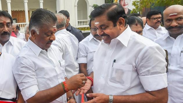 Tamil Nadu Chief Minister K Palaniswami and Deputy Chief Minister O. Panneerselvam offer sweet to party workers after paying floral tribute to AIADMK founder MG Ramachandran on his 102nd birth anniversary and 'Pongal' celebrations at party headquarters, in Chennai on January 17, 2019.(PTI Photo)