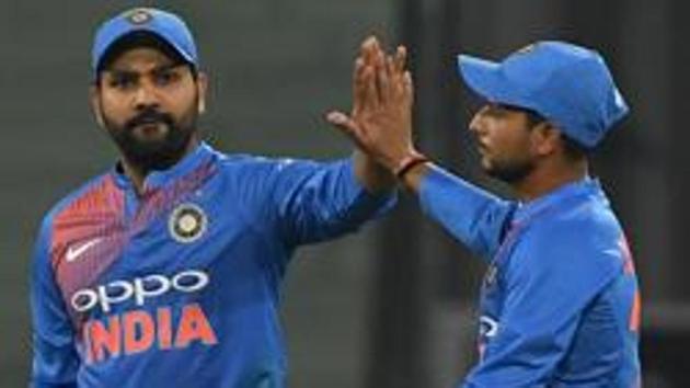 Indian captain Rohit Sharma (L) celebrates with teammate Kuldeep Yadav after taking a catch to dismiss West Indies batsman Keemo Paul during the second T20 cricket match between India and West Indies at The Bharat Ratna Atal Bihari Vajpayee Ekana Cricket Stadium in Lucknow . (AFP) Indian captain Rohit Sharma (L) celebrates with teammate Kuldeep Yadav after taking a catch to dismiss West Indies batsman Keemo Paul during the second T20 cricket match between India and West Indies at The Bharat Ratna Atal Bihari Vajpayee Ekana Cricket Stadium in Lucknow . (AFP)