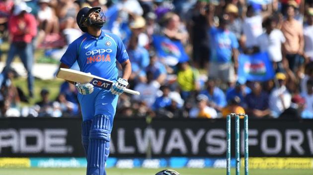 India's Rohit Sharma celebrates reaching his half-century during the second one-day international (ODI) cricket match between New Zealand and India in Tauranga on January 26, 2019(AFP)