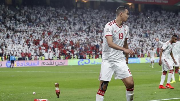 Bottles are thrown on the field by United Arab Emirates fans after Qatar's forward Hasan Al Haydos scores his side's third goal during the AFC Asian Cup semifinal soccer match between United Arab Emirates and Qatar.(AP) Bottles are thrown on the field by United Arab Emirates fans after Qatar's forward Hasan Al Haydos scores his side's third goal during the AFC Asian Cup semifinal soccer match between United Arab Emirates and Qatar.(AP)