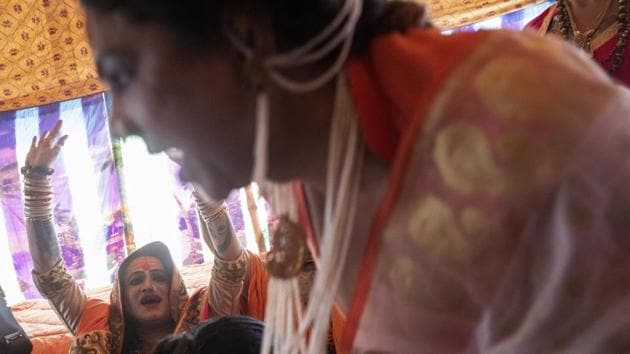 Laxmi Narayan Tripathi, a transgender activist and leader of the “Kinnar akhara” monastic order, celebrates the invitation by the “Juna Akhad” during the Kumbh Mela in Prayagraj. One of the most orthodox orders, the Juna akhara, invited Kinnar to take part in the Kumbh’s first royal bath on January 15. Since then, Tripathi has been pushing for recognition by the umbrella group that sets rules for the akharas. (Bernat Armangue / AP) Laxmi Narayan Tripathi, a transgender activist and leader of the “Kinnar akhara” monastic order, celebrates the invitation by the “Juna Akhad” during the Kumbh Mela in Prayagraj. One of the most orthodox orders, the Juna akhara, invited Kinnar to take part in the Kumbh’s first royal bath on January 15. Since then, Tripathi has been pushing for recognition by the umbrella group that sets rules for the akharas. (Bernat Armangue / AP)