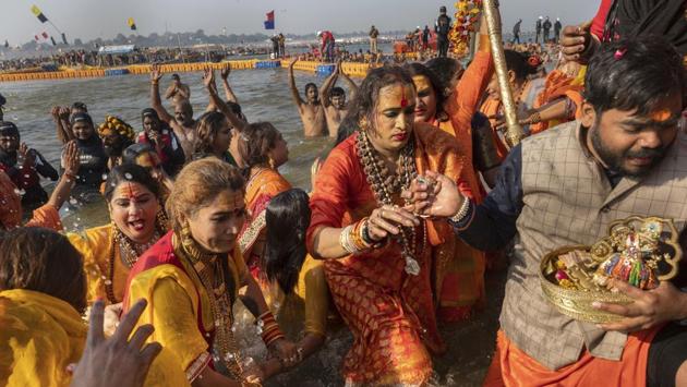 Laxmi Narayan Tripathi(C) takes a dip along with other members on Makar Sankranti day during the Kumbh Mela festival. They bathed in the presence of Juna members. “We have stripped enough in our lives, let us just have fun,” Tripathi said. (Bernat Armangue / AP) Laxmi Narayan Tripathi(C) takes a dip along with other members on Makar Sankranti day during the Kumbh Mela festival. They bathed in the presence of Juna members. “We have stripped enough in our lives, let us just have fun,” Tripathi said. (Bernat Armangue / AP)